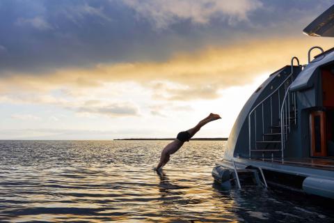 Guest diving off Aqua Mare