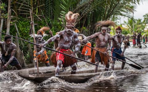 asmat tribe on boats
